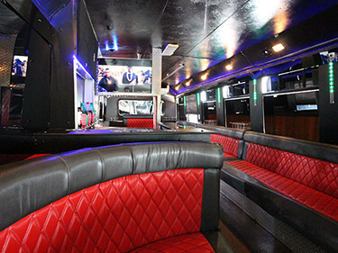 red leather seats inside the GMC limo bus