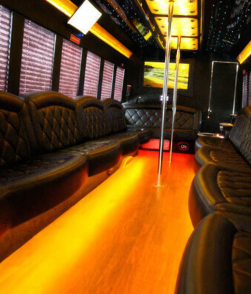 Party limo bus with TVs and dance pole