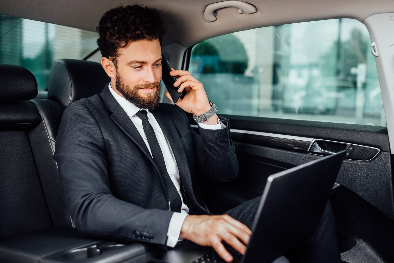 Executive in a White Town car limousine service in Tampa, Florida.